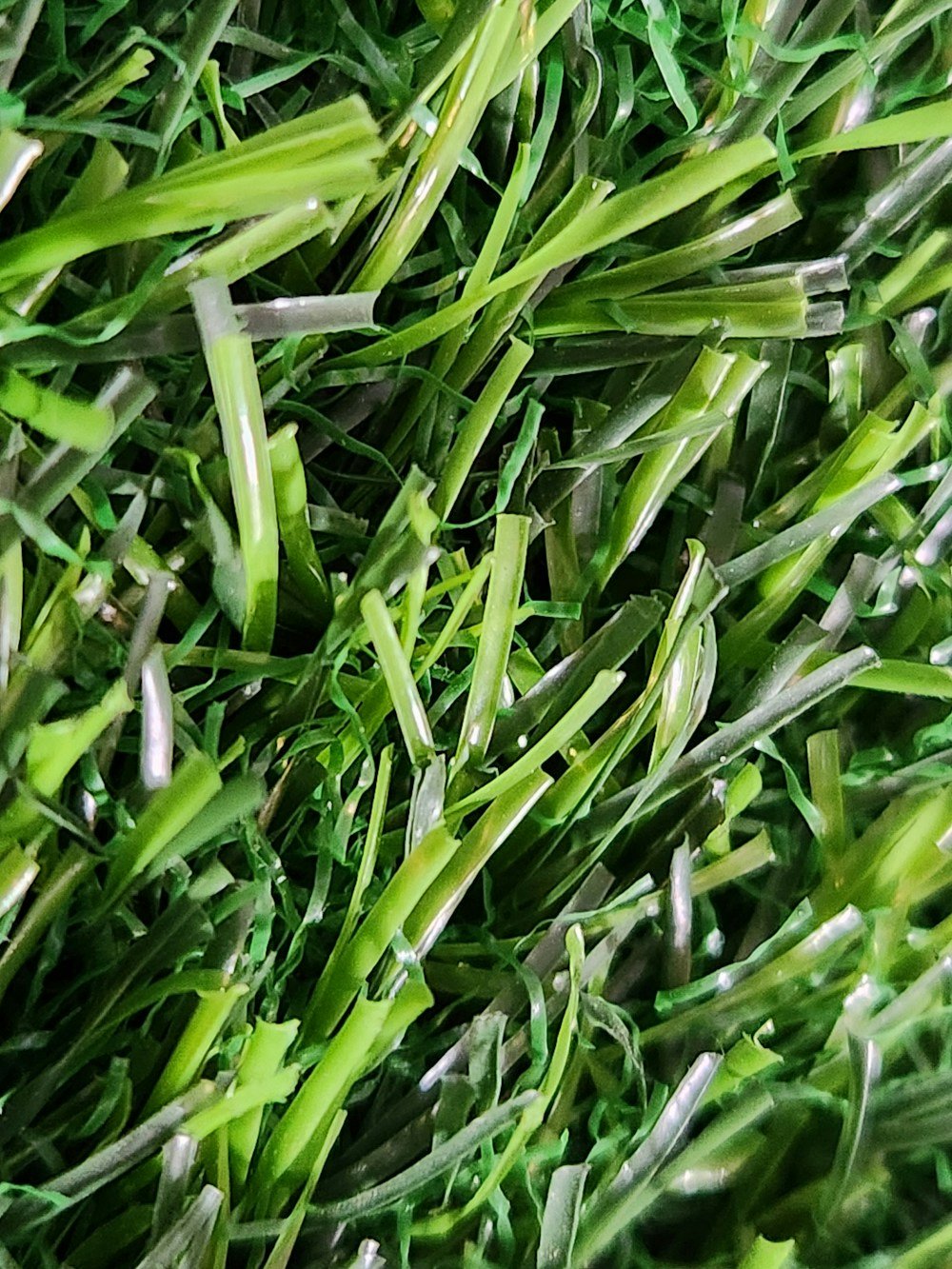 Close-up of green synthetic turf blades